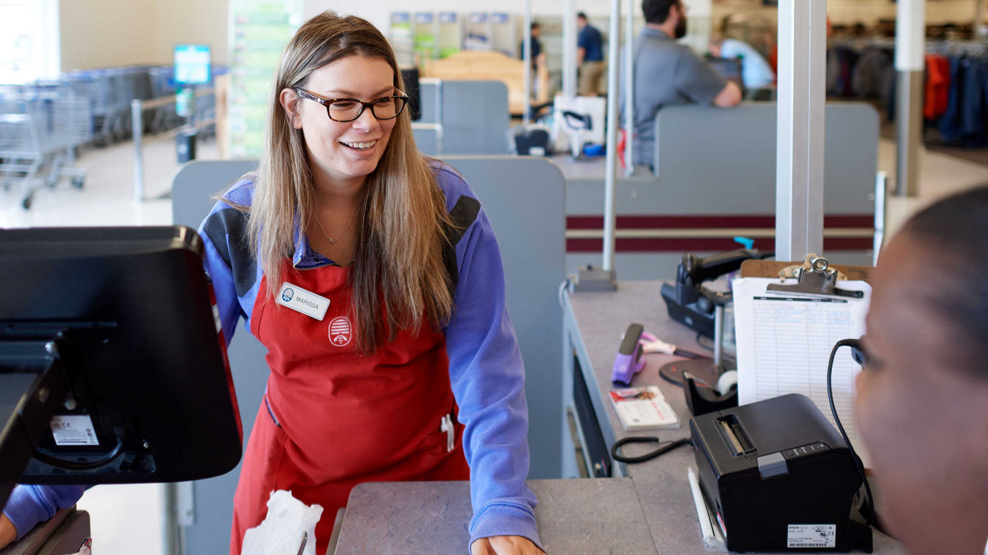 An associate operates a cash register